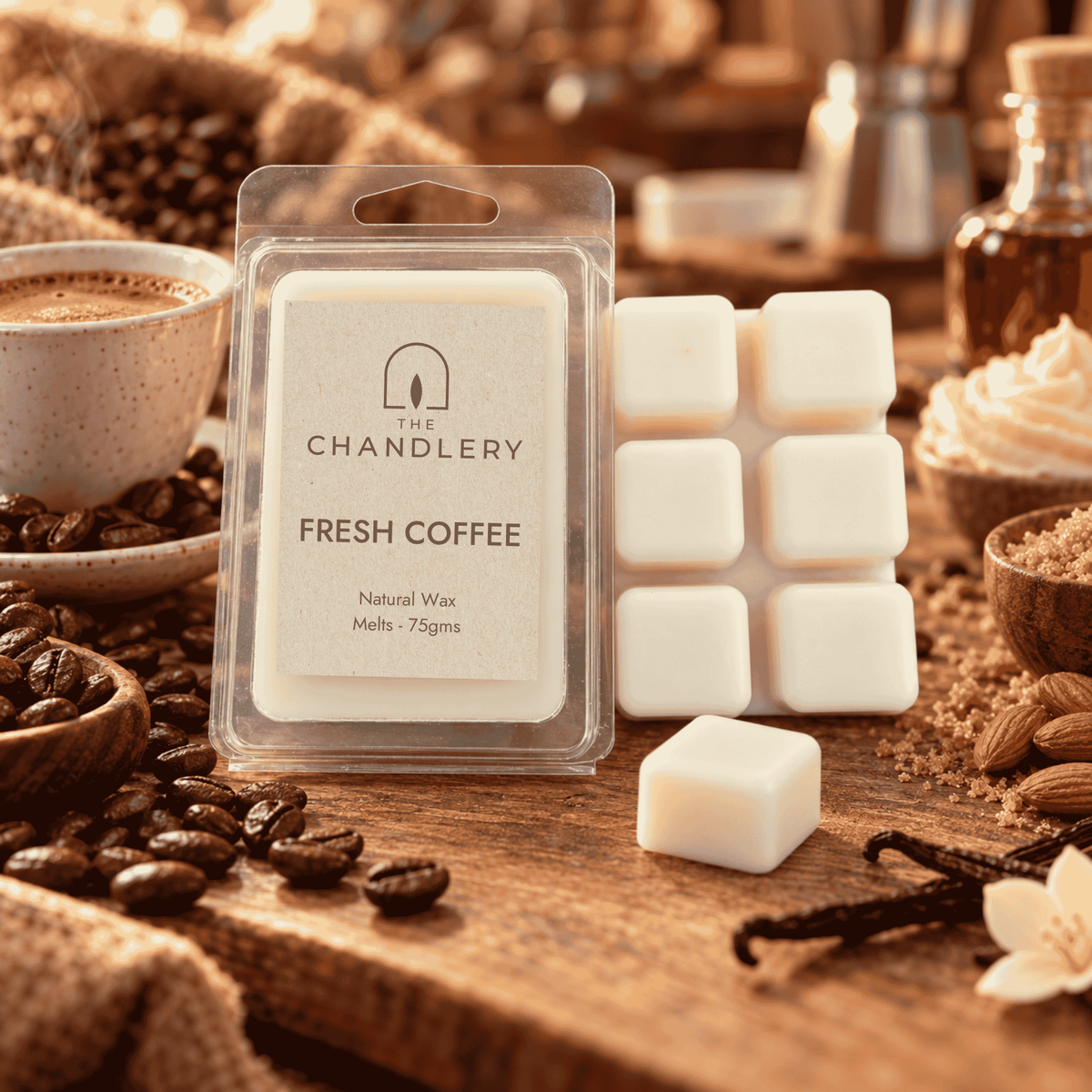 Fresh Coffee wax melt packet and ivory six-cube bar with a loose cube, roasted coffee beans and espresso.