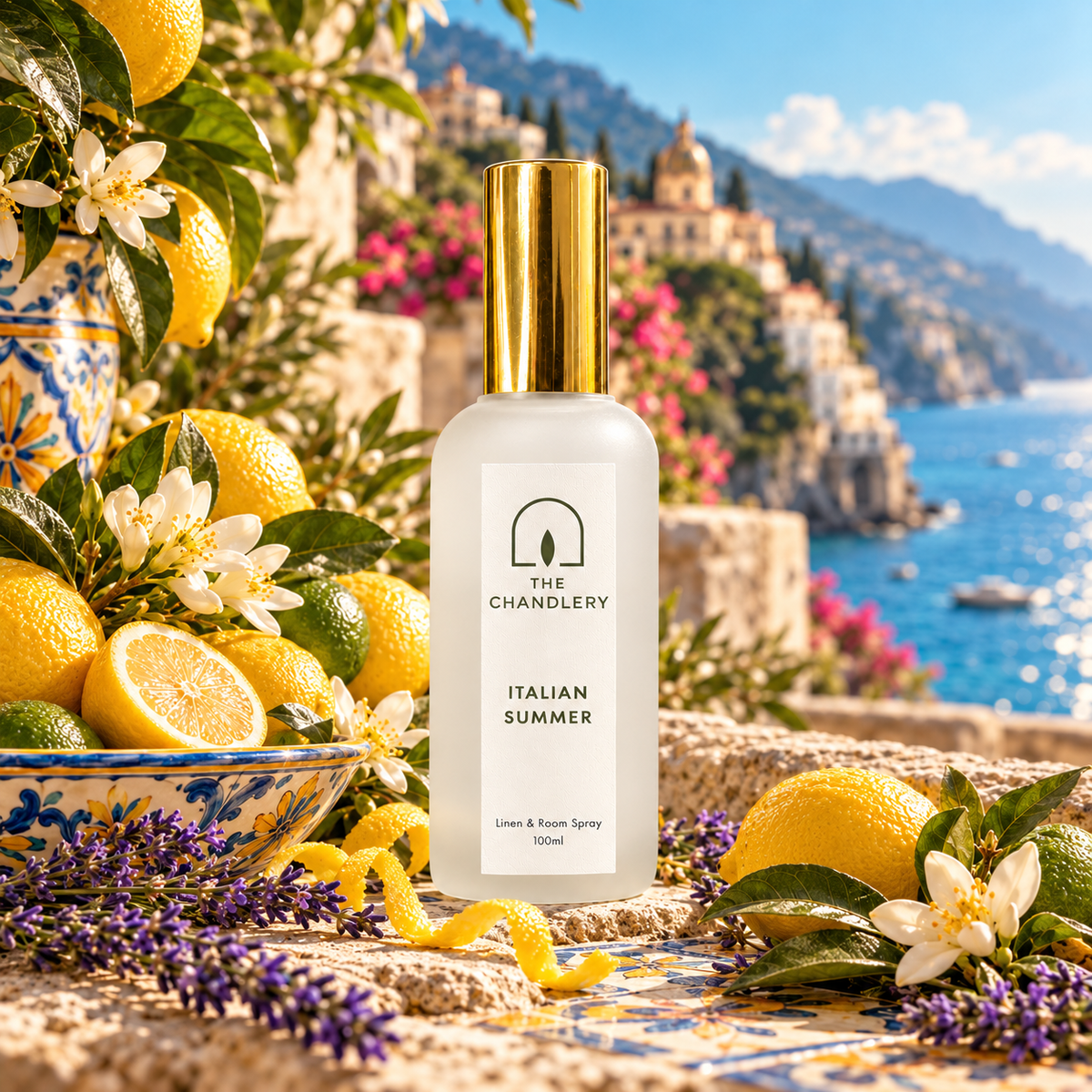 Italian Summer room spray surrounded by lemons, white blossom and lavender above a colourful Mediterranean coastline.